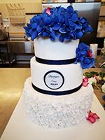 A Cake With Blue Flowers On Top