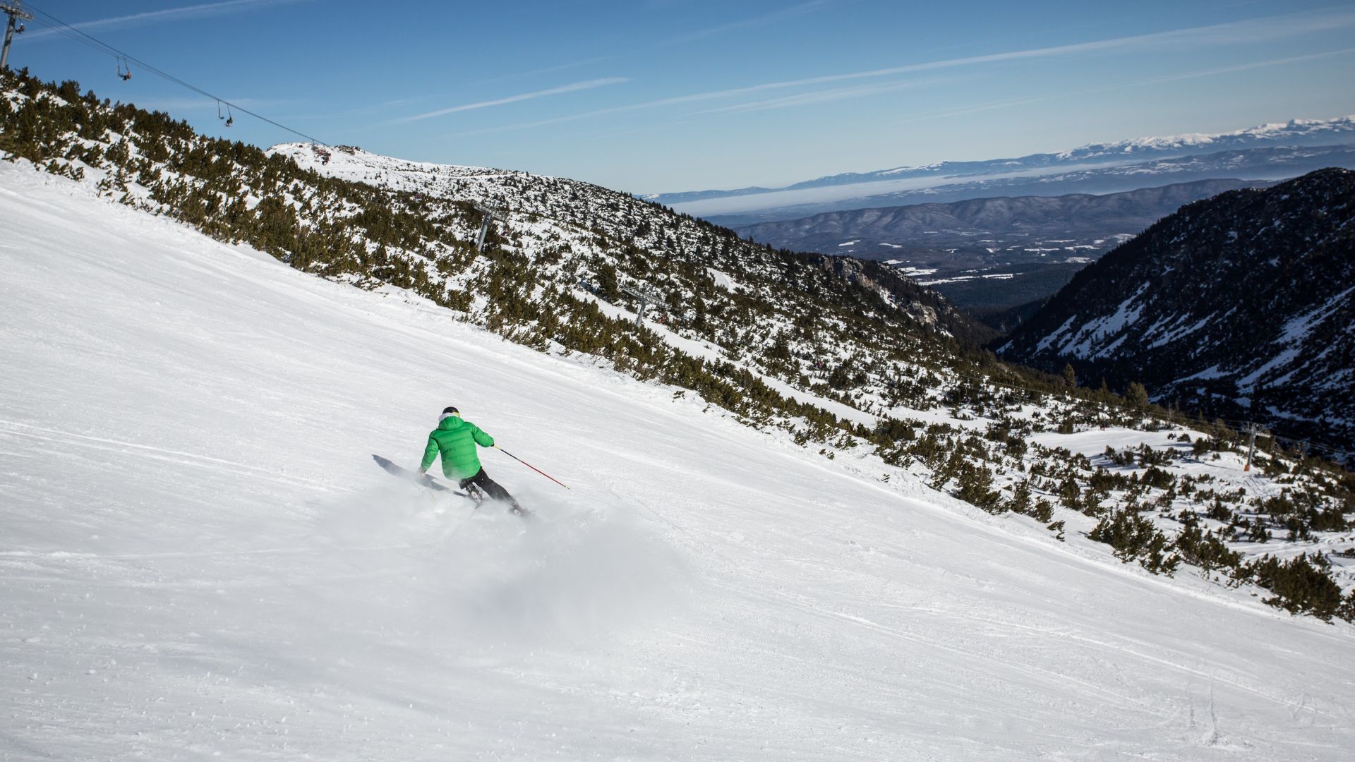 A Person Skiing Down A Mountain