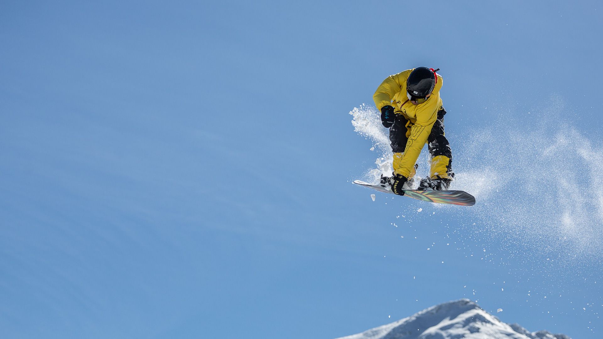 A Snowboarder Flies Through The Air