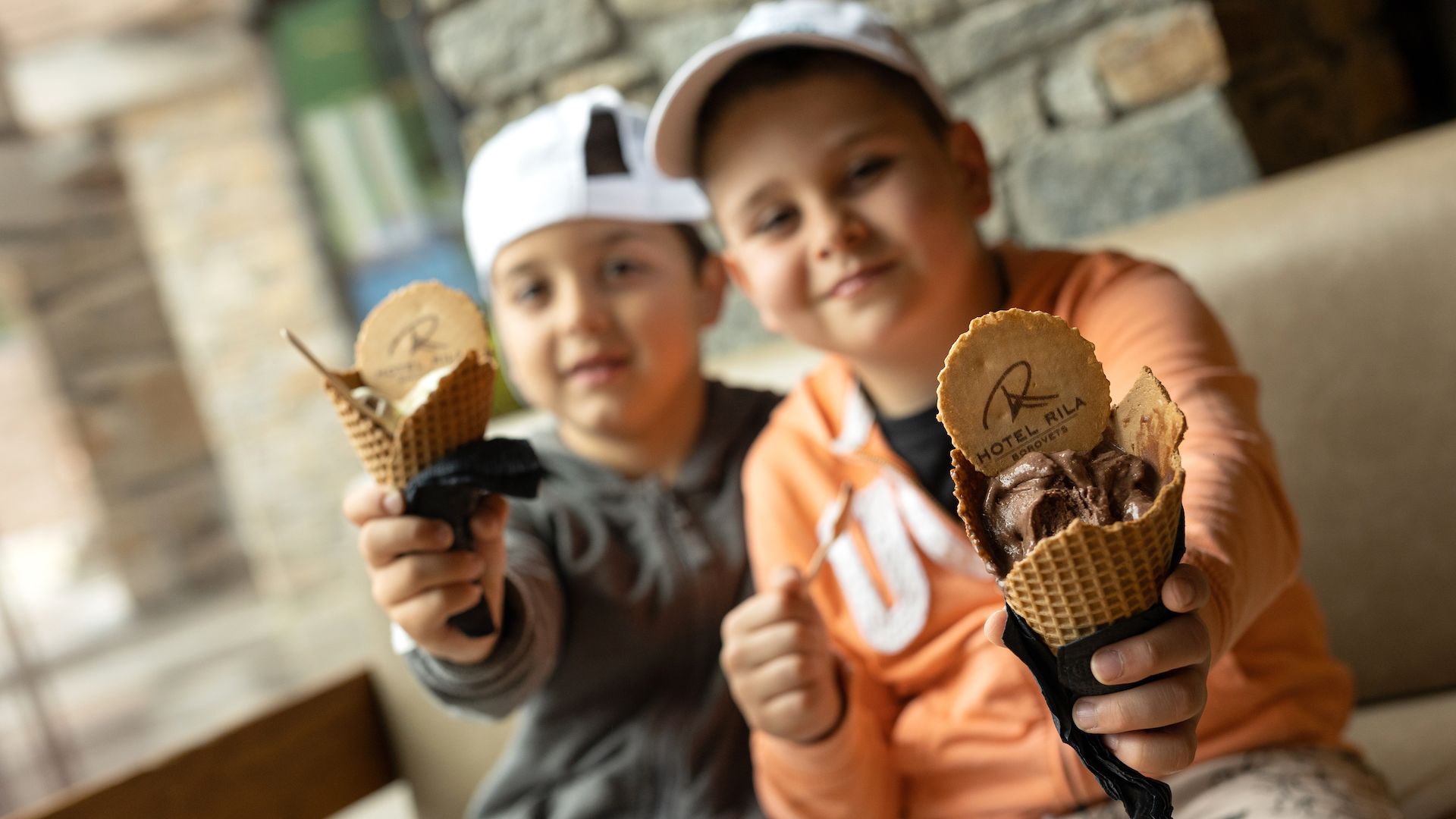 A Couple Of Boys Holding Ice Cream Cones